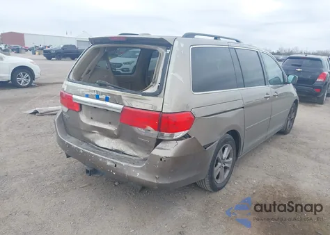 2010 Honda Odyssey Touring z USA, uszkodzony, nr VIN 5FNRL3H90AB047535